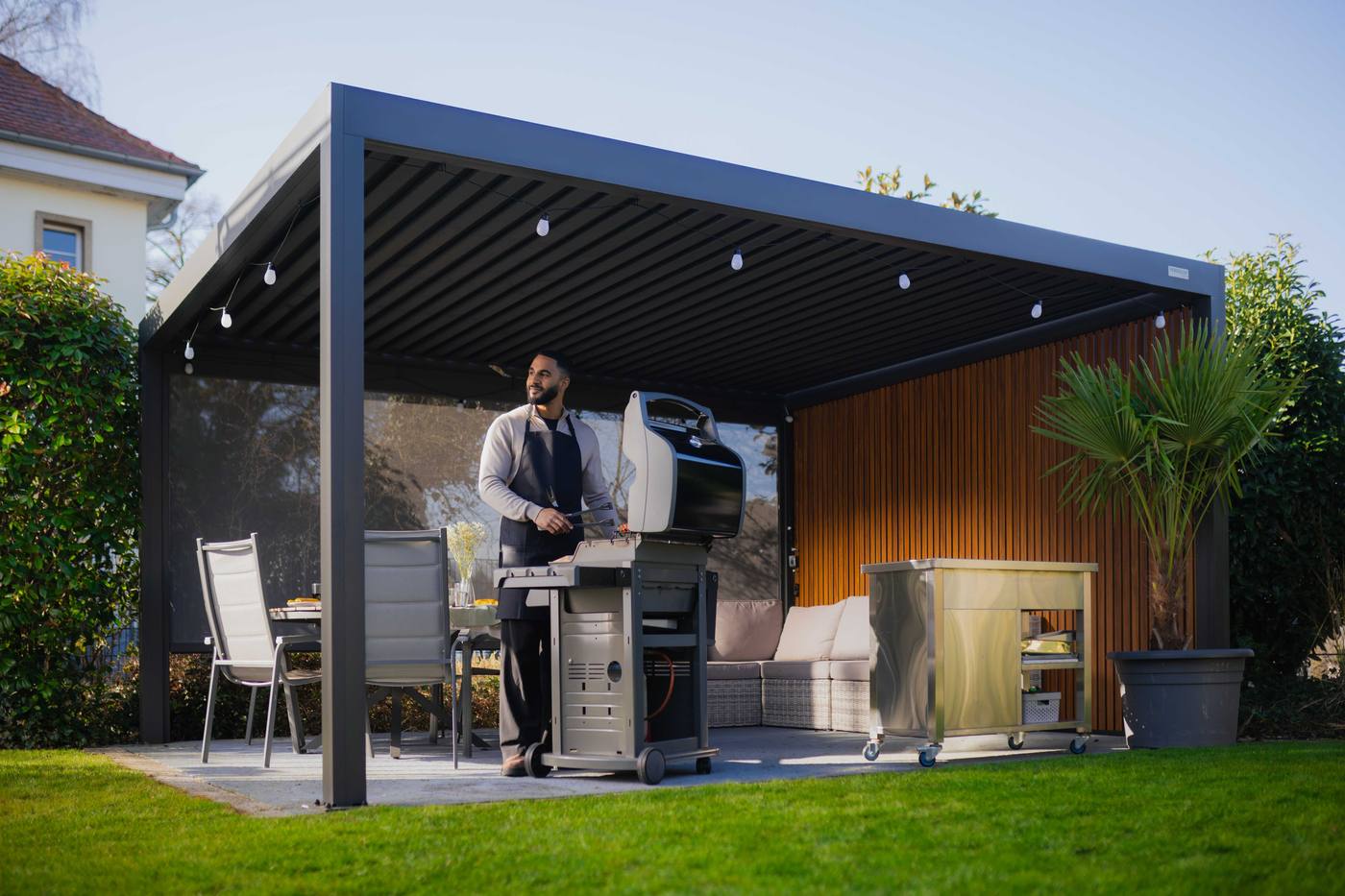 Series 4 Pro Max motorized louvered pergola over a patio dining and grill area